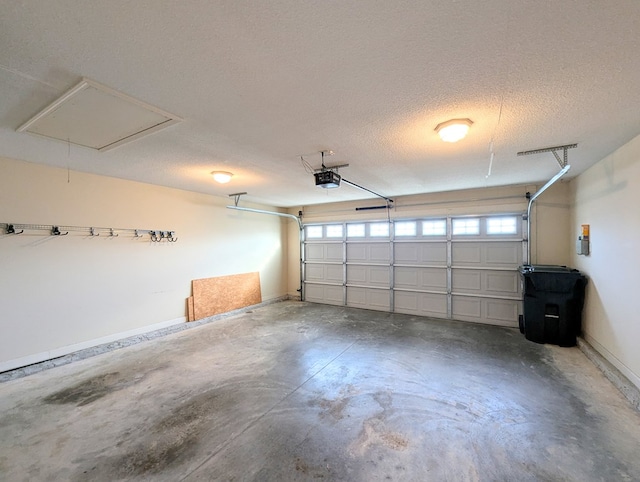 garage with baseboards and a garage door opener