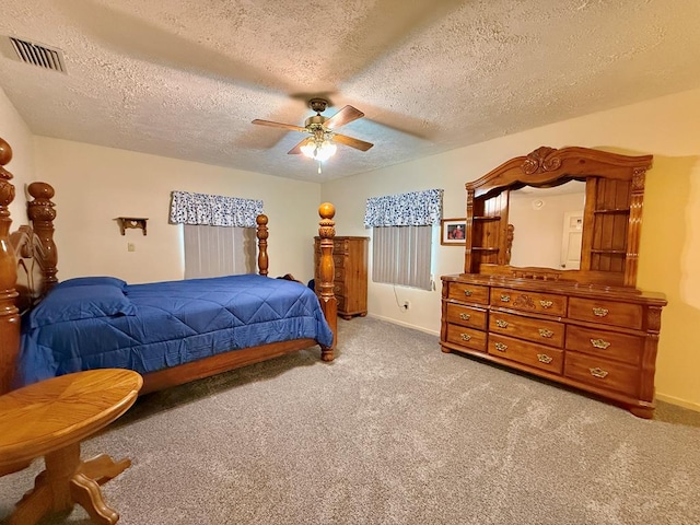 4955 County Road 36, Hartford, AL 36344 - bedroom with carpet, a textured ceiling, a ceiling fan, and baseboards