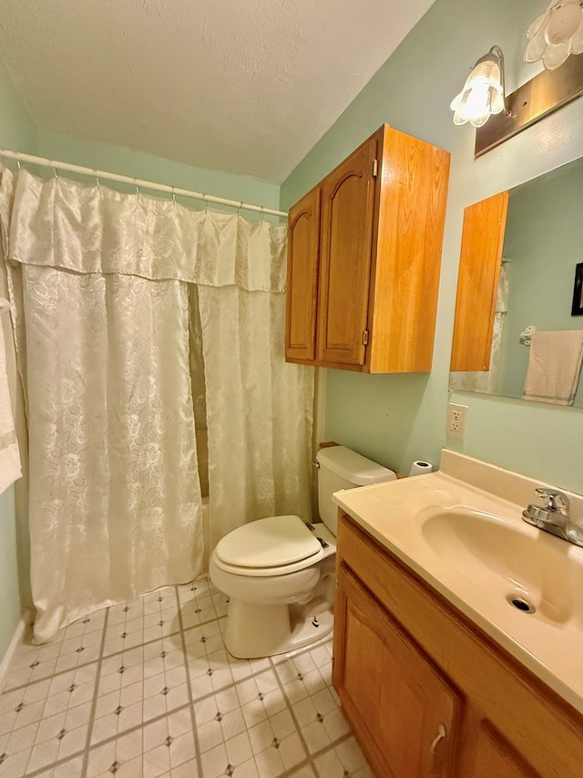 4955 County Road 36, Hartford, AL 36344 - full bathroom with toilet, tile patterned floors, vanity, and a textured ceiling