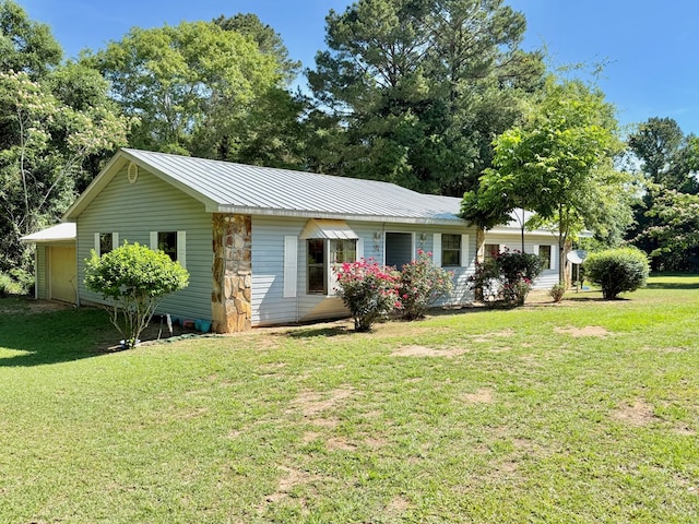 4955 County Road 36, Hartford, AL 36344 - ranch-style home with a front yard, a garage, and metal roof