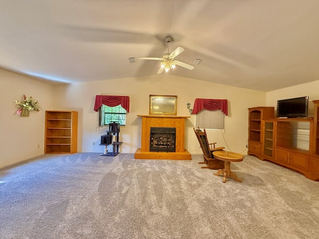 4955 County Road 36, Hartford, AL 36344 - carpeted living area with a fireplace with raised hearth, ceiling fan, and vaulted ceiling