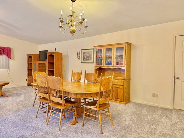 4955 County Road 36, Hartford, AL 36344 - dining area with light colored carpet, a chandelier, and baseboards