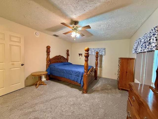 4955 County Road 36, Hartford, AL 36344 - bedroom with carpet floors, a textured ceiling, and a ceiling fan