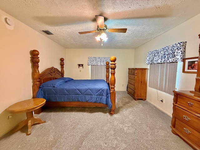 4955 County Road 36, Hartford, AL 36344 - bedroom featuring carpet floors, a textured ceiling, a ceiling fan, and baseboards