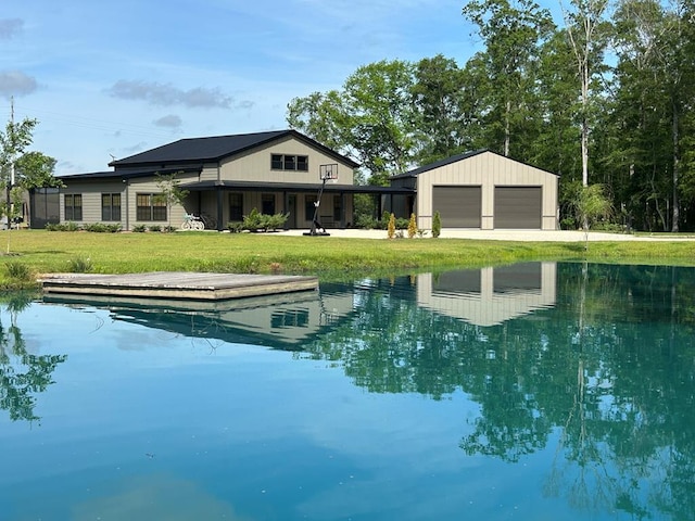 489 Skipper Rd, Malvern, AL 36375 - rear view of house with an outbuilding, a yard, and driveway