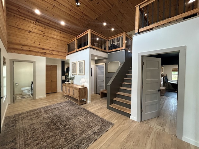 489 Skipper Rd, Malvern, AL 36375 - entrance foyer featuring a high ceiling, wood ceiling, stairway, and light wood-style floors
