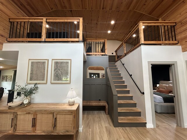 489 Skipper Rd, Malvern, AL 36375 - staircase featuring wood finished floors, recessed lighting, wood ceiling, and a high ceiling