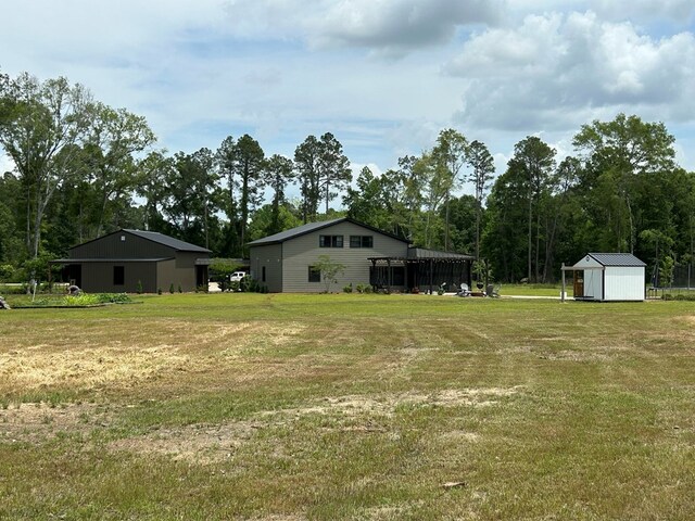 489 Skipper Rd, Malvern, AL 36375 - view of yard featuring an outbuilding and a storage unit