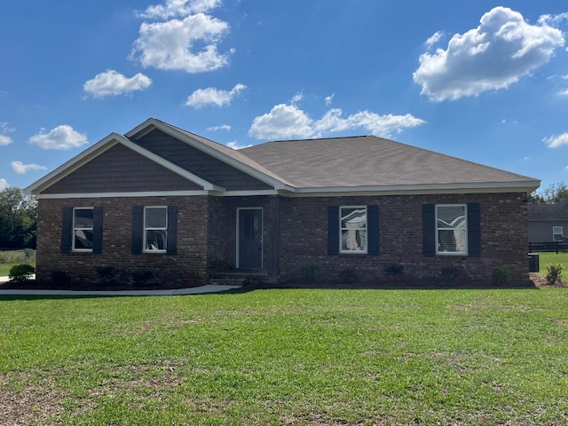 ranch-style house featuring a front lawn