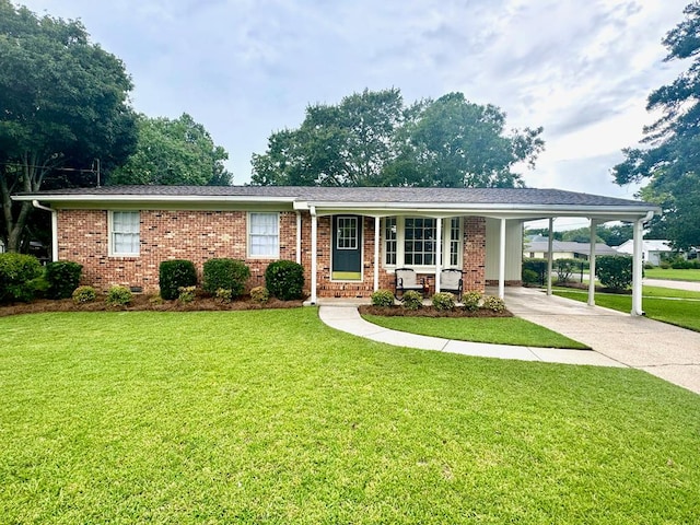 ranch-style house with a carport and a front lawn