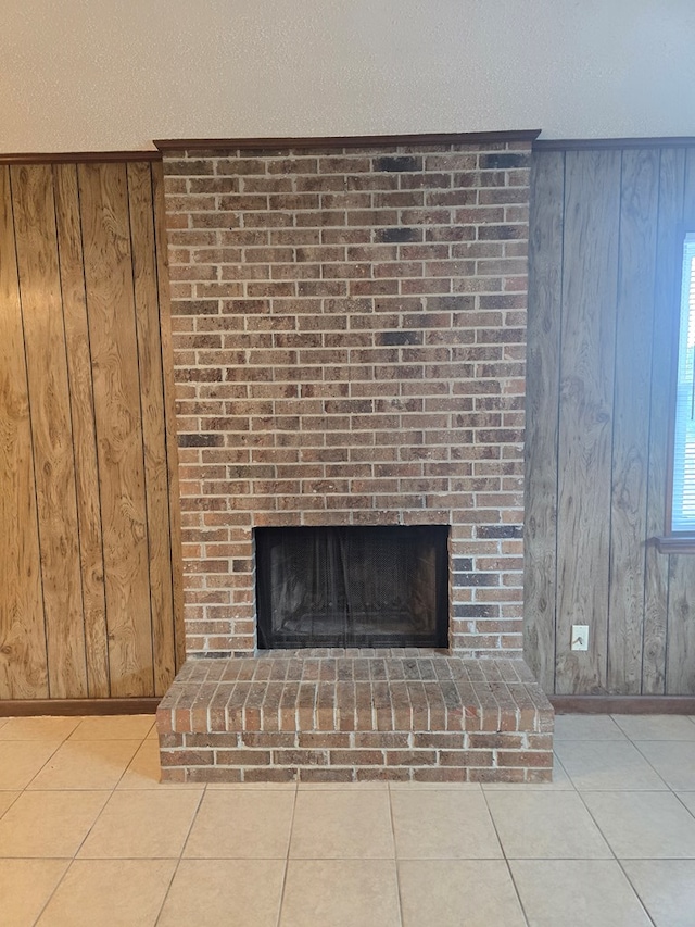 details featuring wooden walls, baseboards, and a brick fireplace