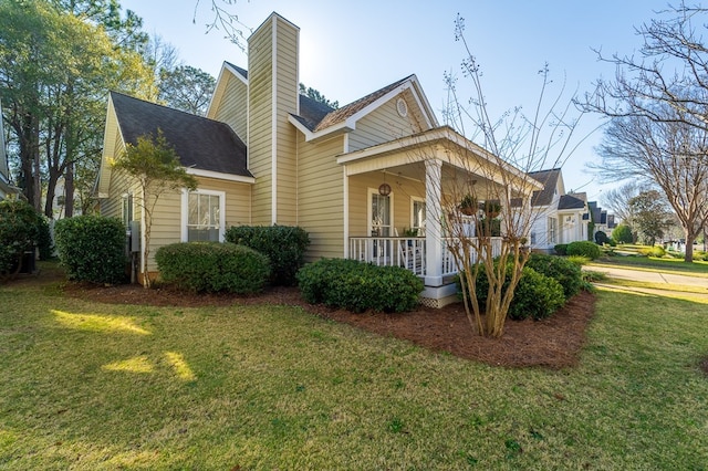 view of front of house with a front lawn and covered porch