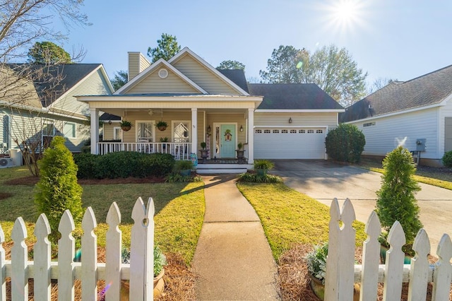 view of front of home with a front lawn and a garage