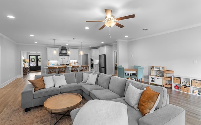 652 Charleston Mills Dr, Dothan, AL 36350 - living area with recessed lighting, light wood finished floors, ornamental molding, and ceiling fan