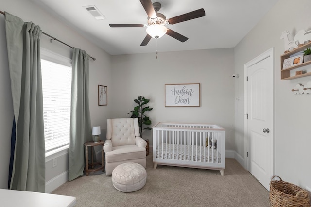 652 Charleston Mills Dr, Dothan, AL 36350 - carpeted bedroom with visible vents, multiple windows, a ceiling fan, and a nursery area