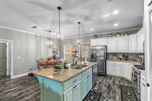 kitchen featuring crown molding, a sink, white cabinetry, stainless steel appliances, and visible vents