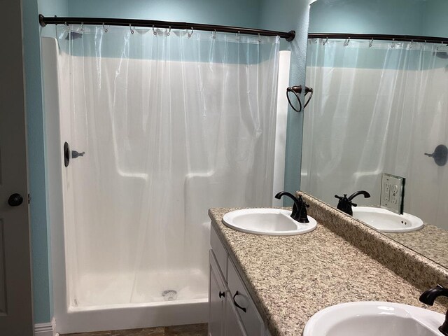 116 Jules Ln, Ashford, AL 36312 - bathroom with double vanity and a shower with curtain