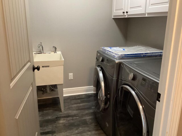 116 Jules Ln, Ashford, AL 36312 - washroom featuring dark wood-style flooring, independent washer and dryer, cabinet space, and baseboards