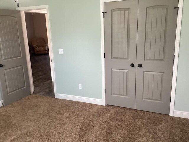 116 Jules Ln, Ashford, AL 36312 - unfurnished bedroom with carpet flooring, a closet, and baseboards