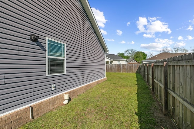 view of yard with a fenced backyard