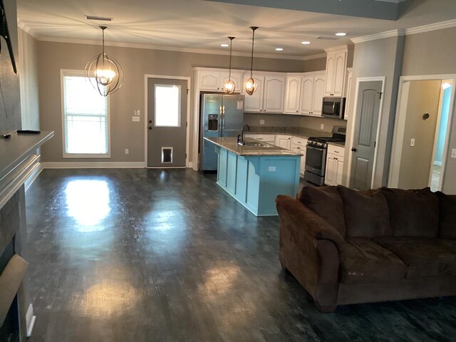 116 Jules Ln, Ashford, AL 36312 - kitchen featuring appliances with stainless steel finishes, open floor plan, white cabinets, ornamental molding, and baseboards