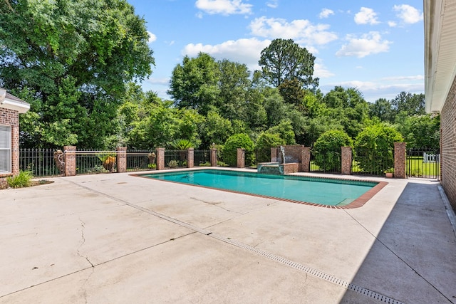 601 Edinburgh Way, Dothan, AL 36305 - view of pool featuring a patio, a pool with connected hot tub, and view of scattered trees