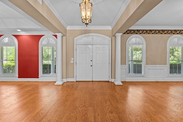 601 Edinburgh Way, Dothan, AL 36305 - entryway with decorative columns, wood finished floors, a chandelier, crown molding, and wainscoting