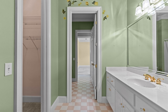 601 Edinburgh Way, Dothan, AL 36305 - bathroom with vanity, baseboards, a spacious closet, and tile patterned floors