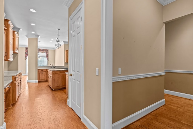 601 Edinburgh Way, Dothan, AL 36305 - hall featuring light wood-style flooring, crown molding, baseboards, a sink, and recessed lighting