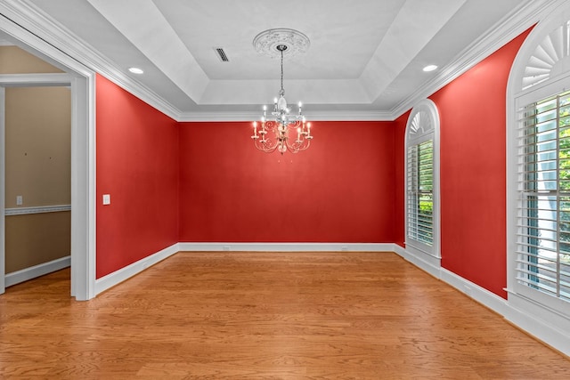 601 Edinburgh Way, Dothan, AL 36305 - empty room with a chandelier, wood finished floors, baseboards, a tray ceiling, and recessed lighting