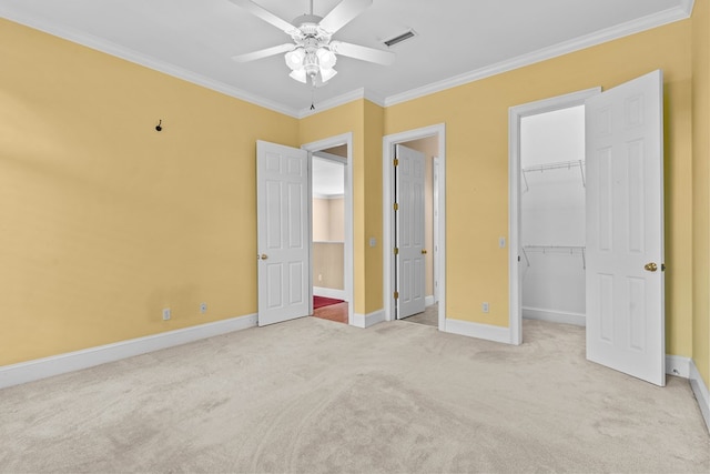 601 Edinburgh Way, Dothan, AL 36305 - unfurnished bedroom featuring carpet floors, crown molding, baseboards, a walk in closet, and a closet