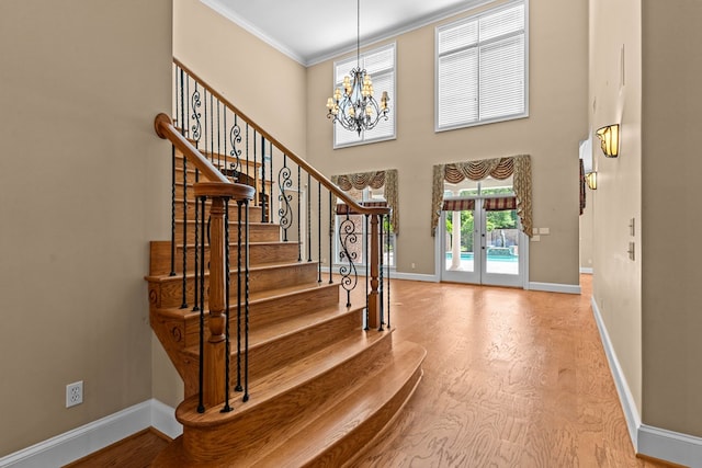601 Edinburgh Way, Dothan, AL 36305 - entryway with a chandelier, baseboards, crown molding, wood finished floors, and stairway