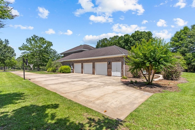 601 Edinburgh Way, Dothan, AL 36305 - view of side of property featuring a garage, driveway, a lawn, and brick siding