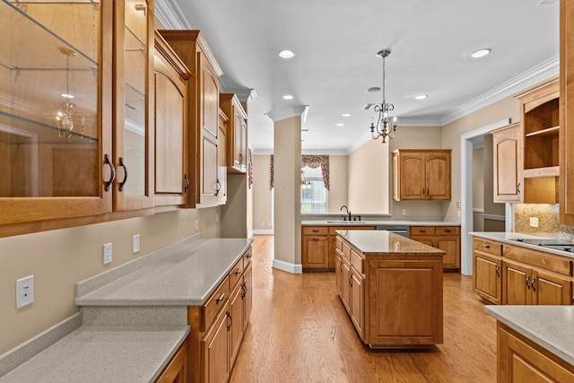 601 Edinburgh Way, Dothan, AL 36305 - kitchen with crown molding, light wood-type flooring, a sink, brown cabinetry, and hanging light fixtures