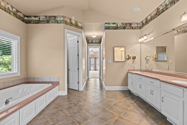 601 Edinburgh Way, Dothan, AL 36305 - full bath with plenty of natural light, double vanity, lofted ceiling, a garden tub, and baseboards