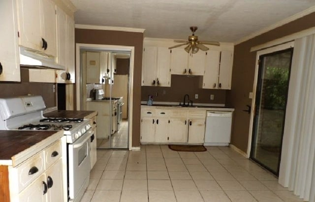 kitchen with white appliances, ceiling fan, sink, white cabinetry, and light tile patterned flooring