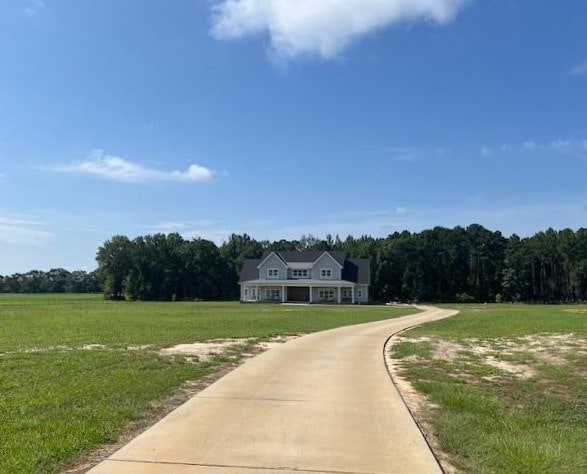 1015 Hardy Rd, Dothan, AL 36301 - view of front of home with a front lawn and a view of trees