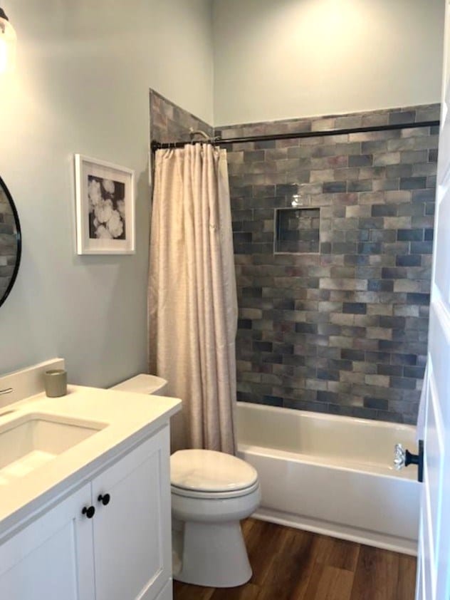 1015 Hardy Rd, Dothan, AL 36301 - full bathroom with vanity, wood finished floors, and shower / bath combo