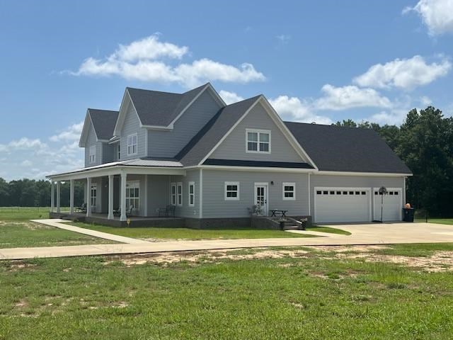 1015 Hardy Rd, Dothan, AL 36301 - view of front of property featuring driveway, a garage, a front lawn, and covered porch