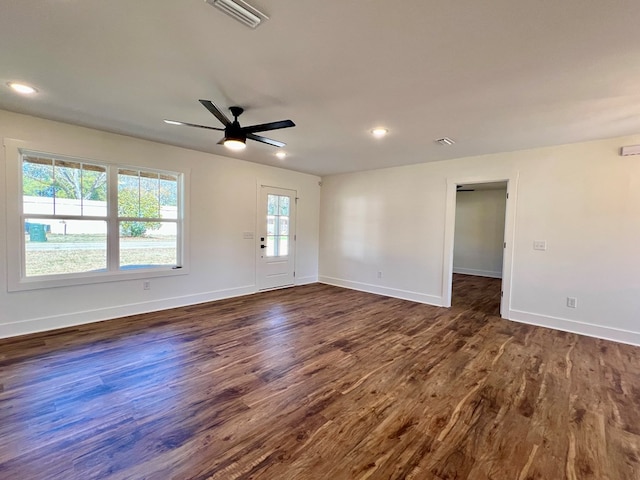 unfurnished room with ceiling fan and dark hardwood / wood-style flooring