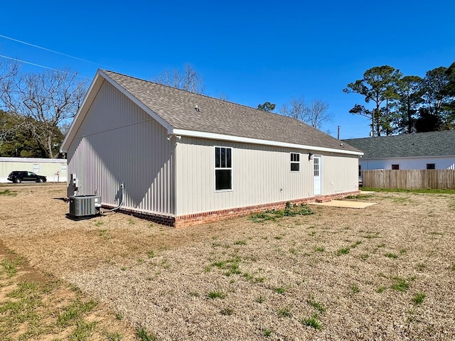 rear view of property with cooling unit