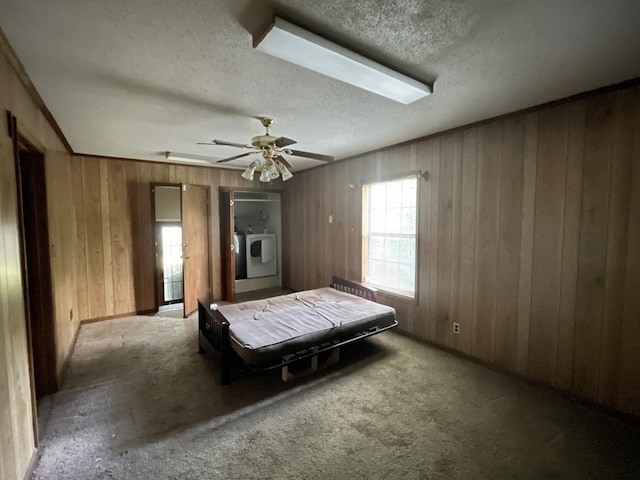 511 W Franklin St, Dothan, AL 36301 - carpeted bedroom with a textured ceiling, wooden walls, and a ceiling fan