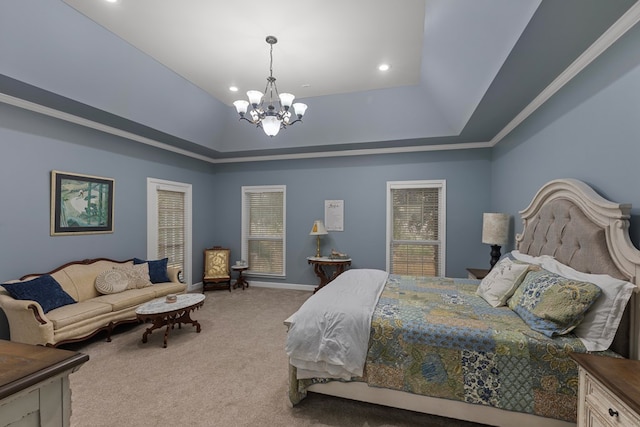 carpeted bedroom with a tray ceiling, ornamental molding, and a notable chandelier