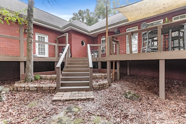 rear view of property with a deck