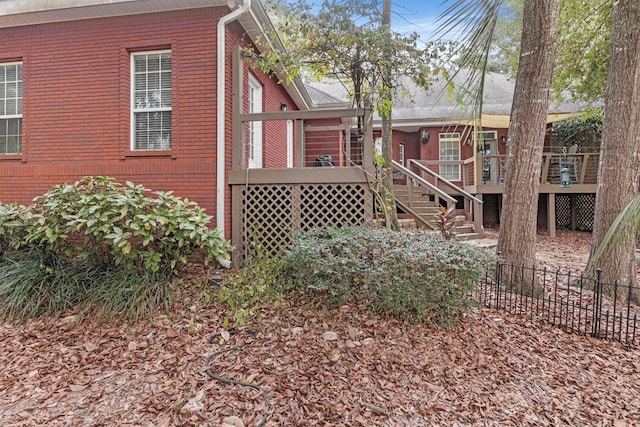 view of side of home with a deck