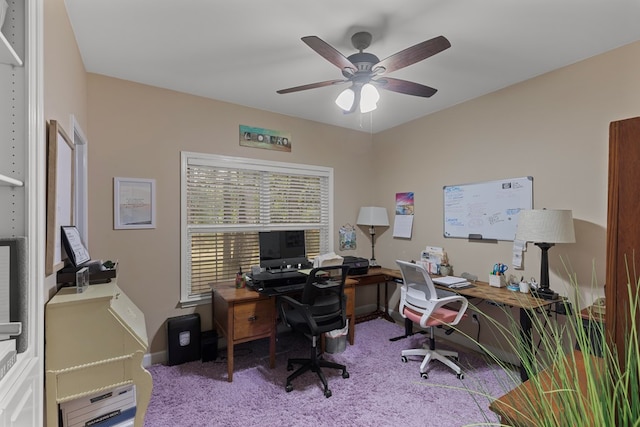 carpeted home office with ceiling fan