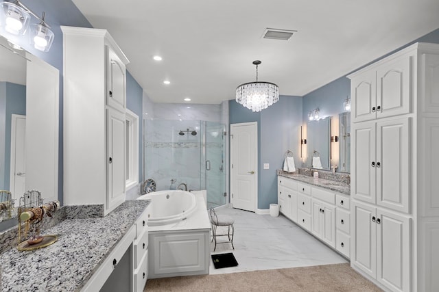 bathroom with plus walk in shower, vanity, and a chandelier