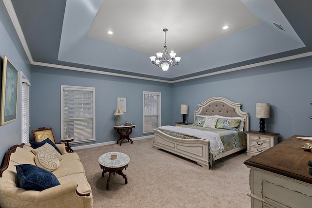 bedroom featuring a chandelier, light colored carpet, ornamental molding, and a tray ceiling