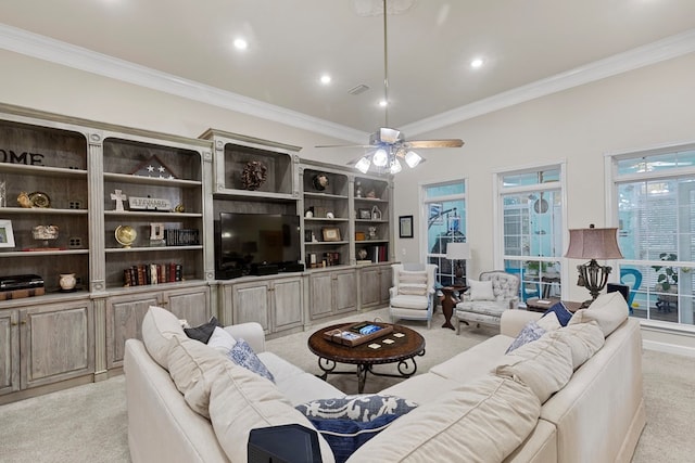 living room with ceiling fan, light colored carpet, and crown molding