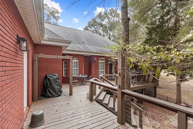 wooden deck with grilling area